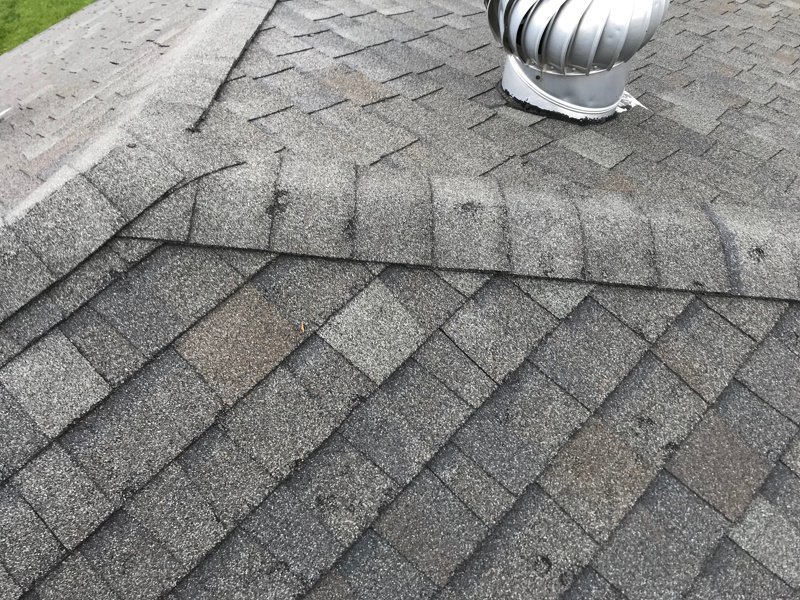 Roofing shingles showing damage from hail